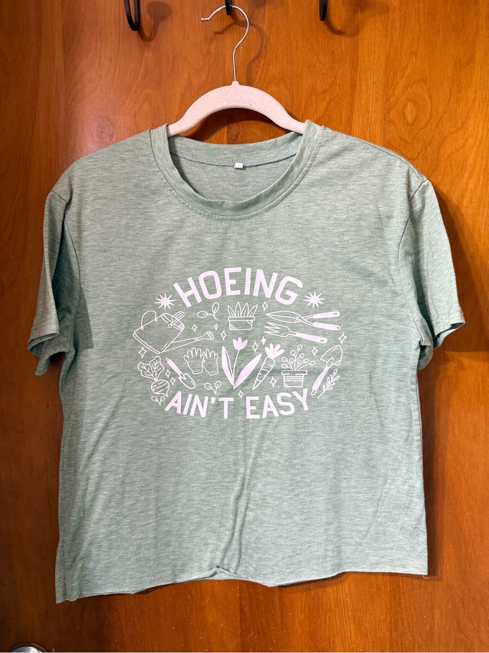 Graphic Tee "Hoeing Ain't Easy" in Sage Green